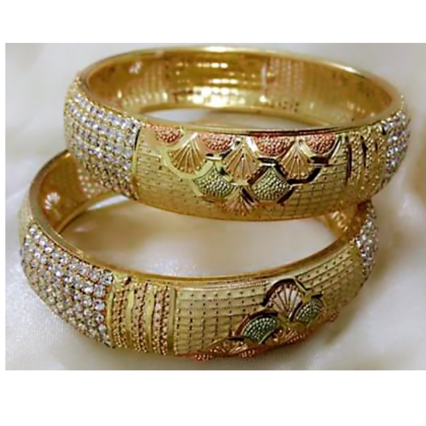 Gold Plated Designer set of 2 Bangles for girls or Women, with zirconia artificial diamond stones.