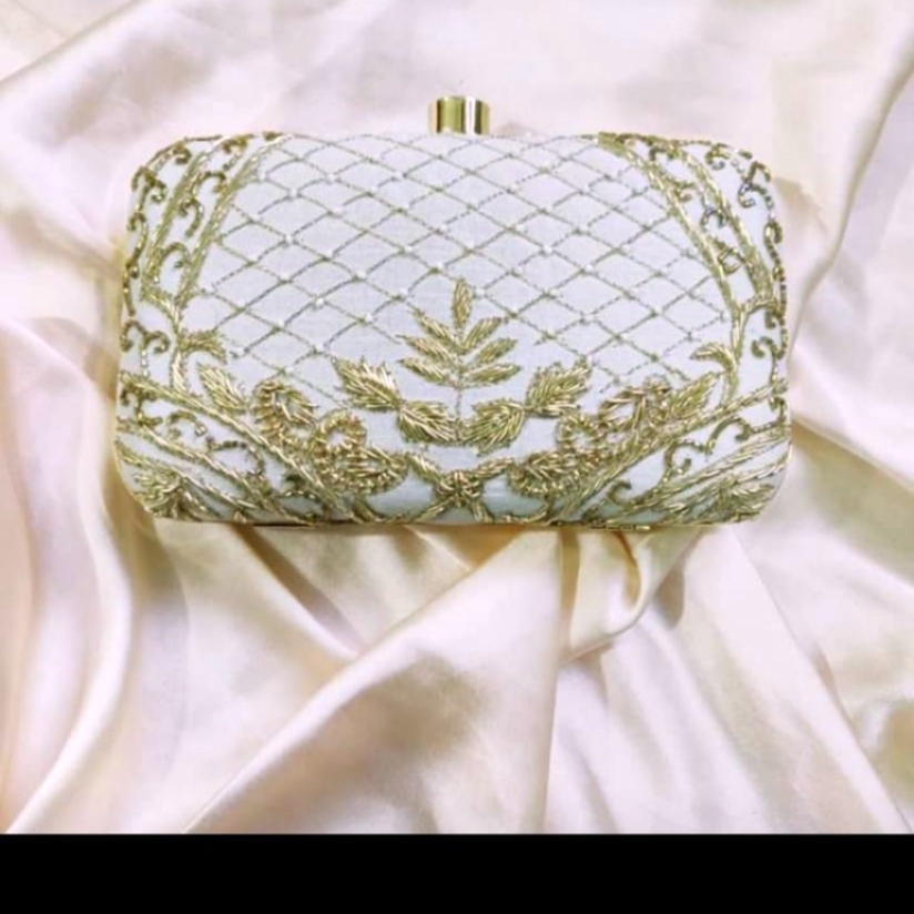 Handicraft clutch with golden work 