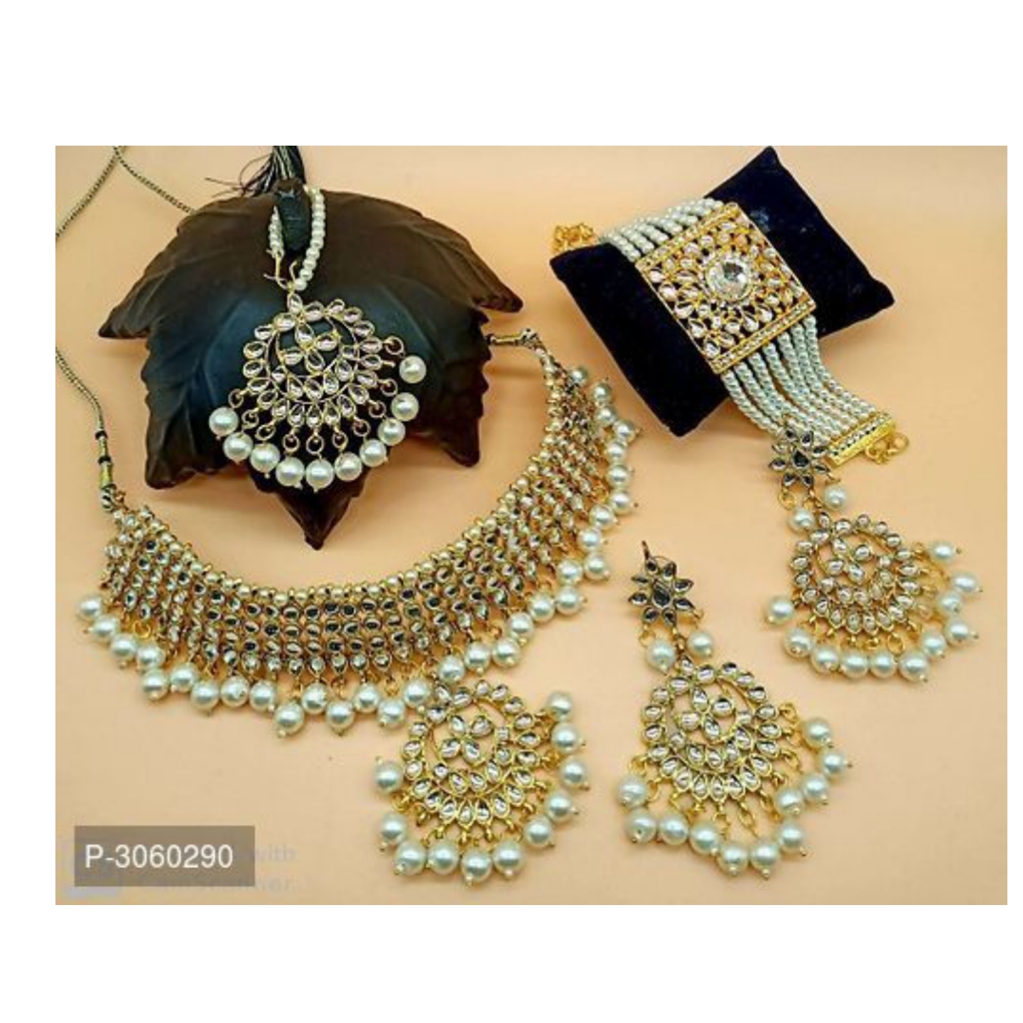 Designer Pearl Kundan Jewellery Combo Including Pair Of Earring and Maang Tikka and Bracelet