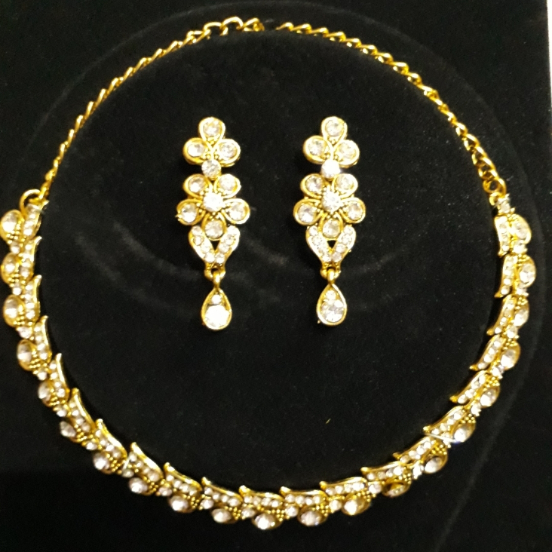 Golden American Diamond Necklace with beautiful earrings.