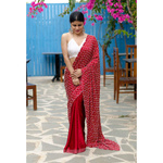 Handembroidered satin silk saree enhanced with zari scallops and border.