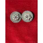 Handmade silver studs.