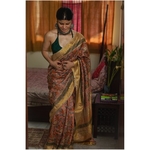 Handwoven and handblock printed tussar silk saree.