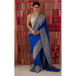 Handwoven kadhwa moonga silk banarasi saree with silver gold jari motifs.
