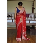 Handwoven chiffon banarasi saree with handwoven silver jari motifs.