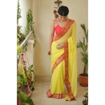 Chiffon saree with embroidered border and hand embroidered motifs in beads pearls.