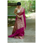 Handwoven organza kora banarasi silk saree with kadhwa border and bootis.