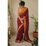 Chiffon saree with embroidered border and hand embroidered motifs in beads pearls.