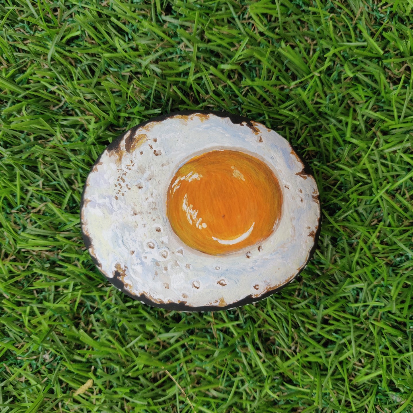 Realistic sunny side up realistuc Egg handpainted on rock for an egg lover