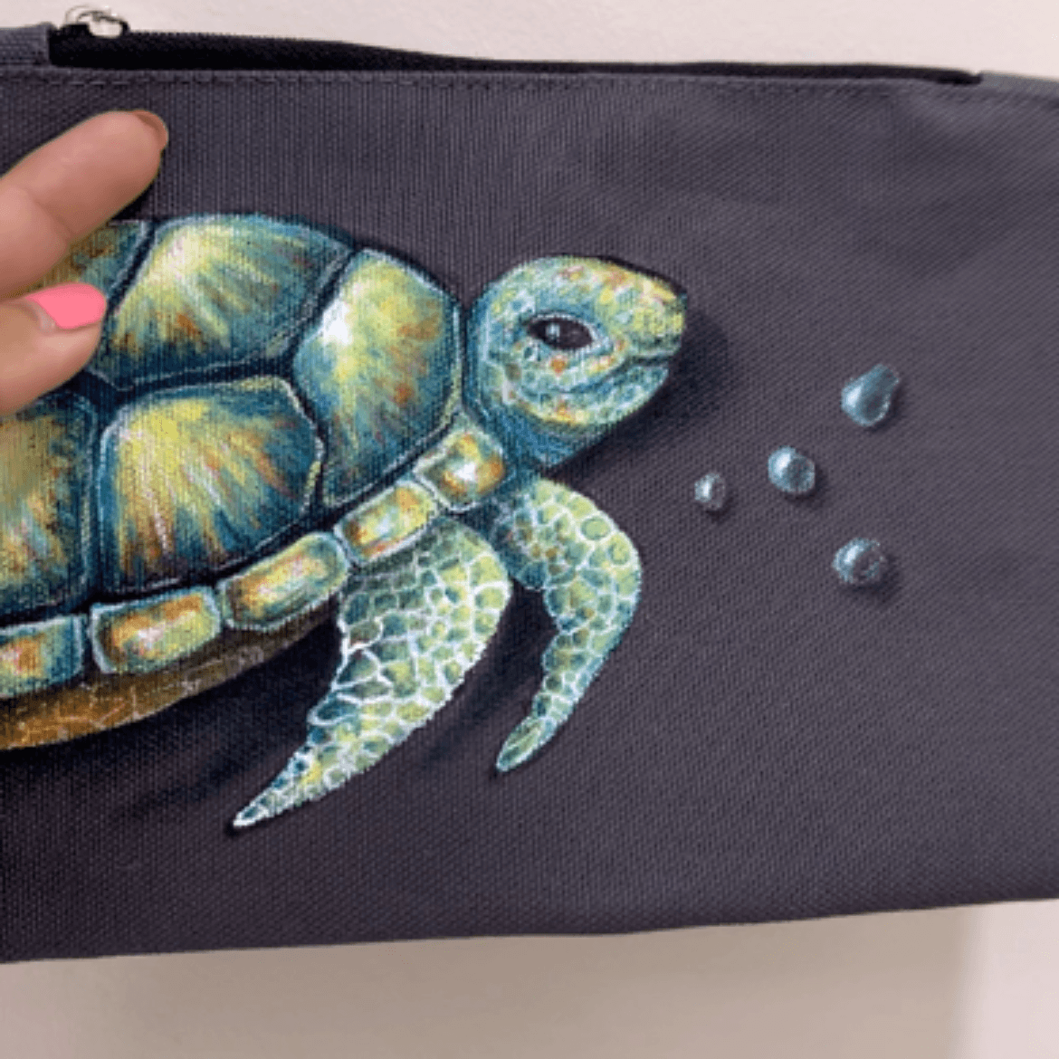 sea turtle hand painted on a fabric pouch