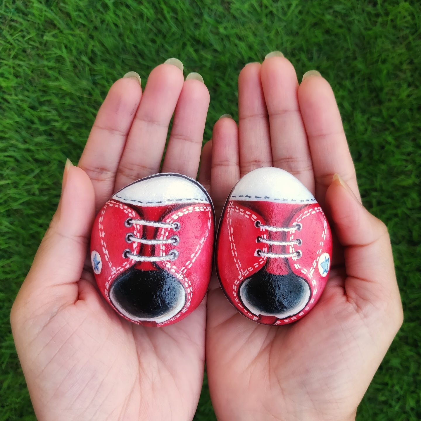 Cute pair of Baby converse shoes hand painted on rock