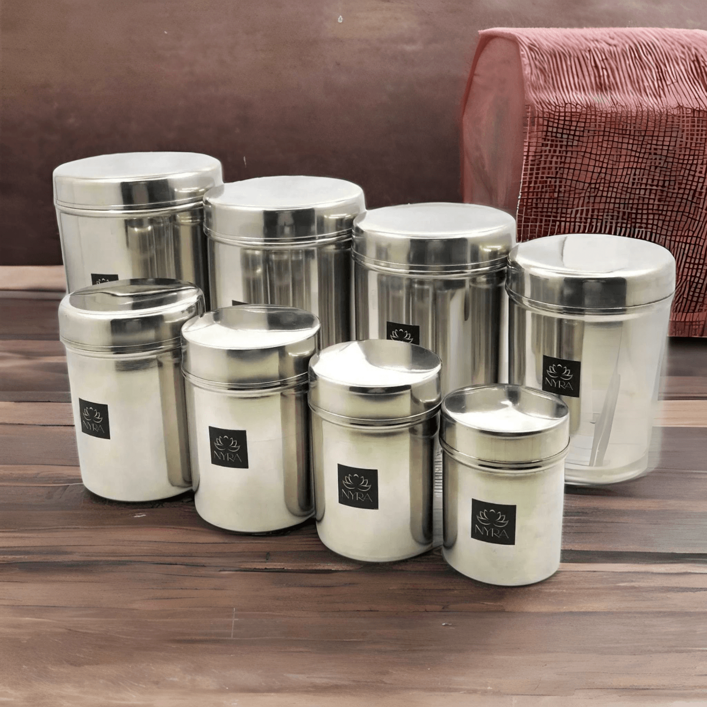 Nyra Stainless-Steel Cylindrical Shaped Deep Storage Box Containers DibbaDubba Set of 8 capacity from 300 ML to 2.6 ltr