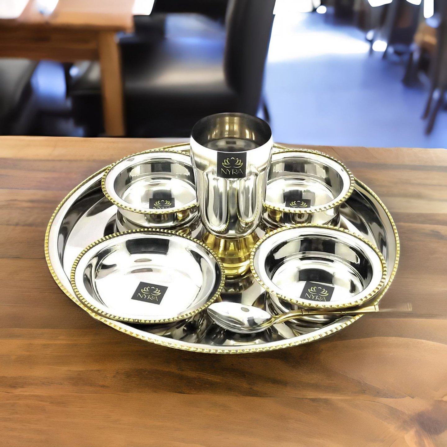 Nyra Stainless-Steel Two-Tone Thali set with a minute detailing of Brass on the outers of the set  7 Pcs Set