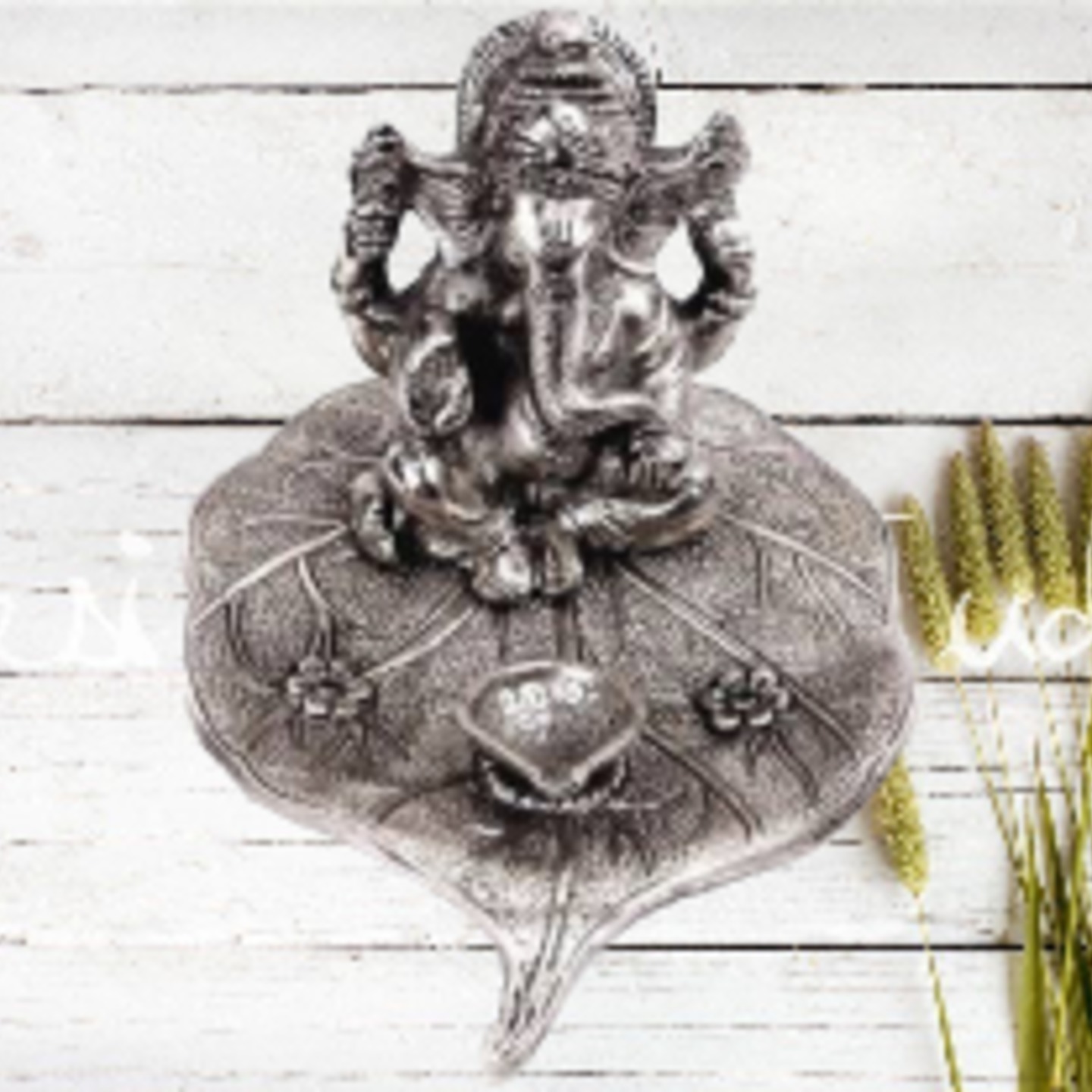 White Metal Lord Ganesha on Paan Leaf with Diya