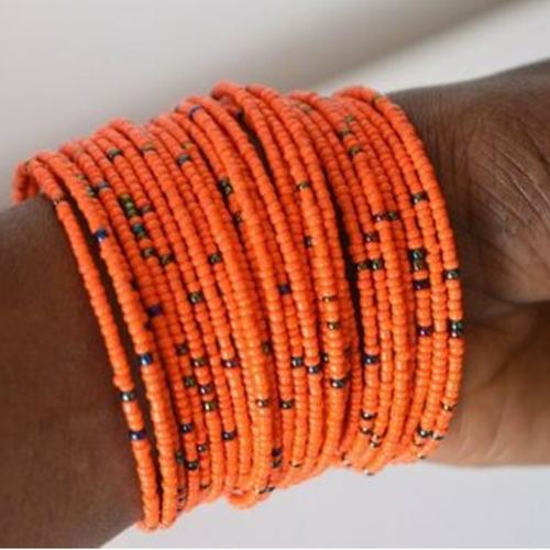 Orange  beaded African coil bangle