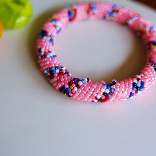 Pink and multicolour beaded bangle