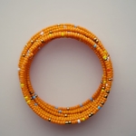 Orange  beaded African coil bracelets