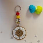 white and golden beaded keychain