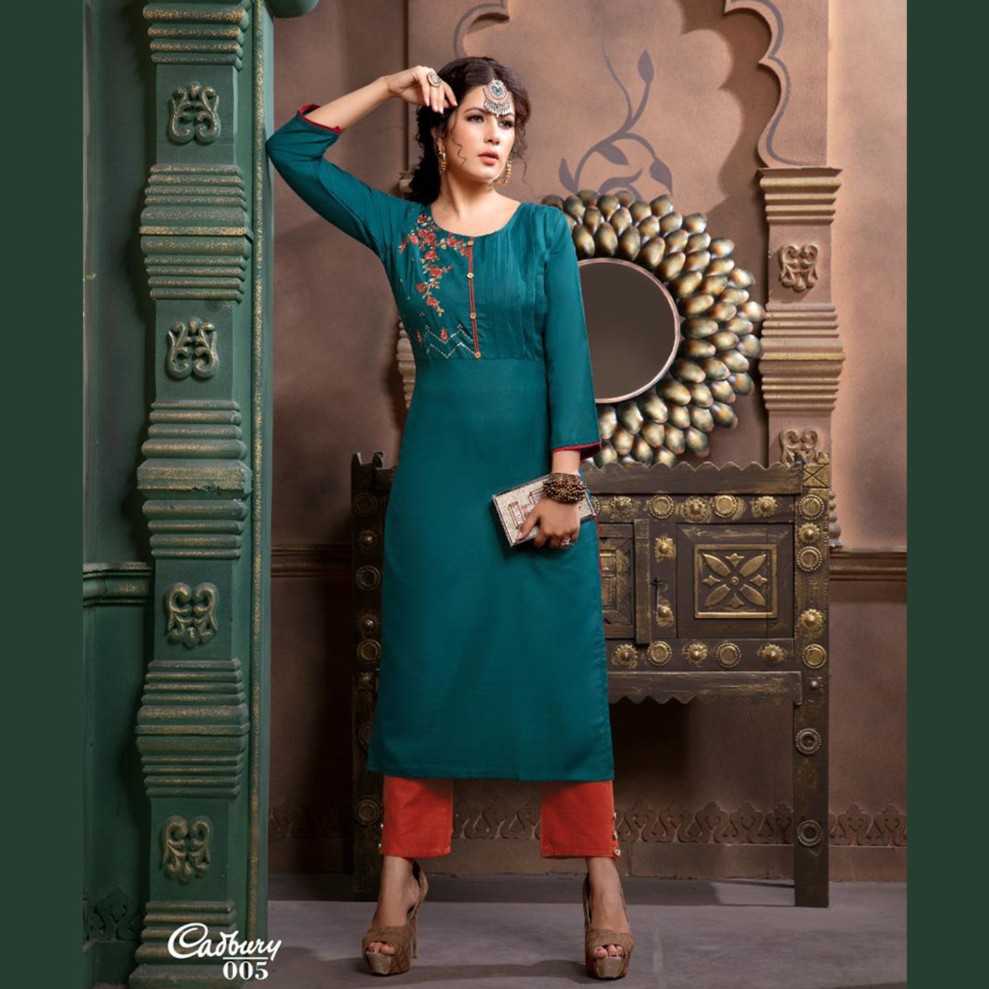 Women Embroidered Solid A-line Kurta with Trousers