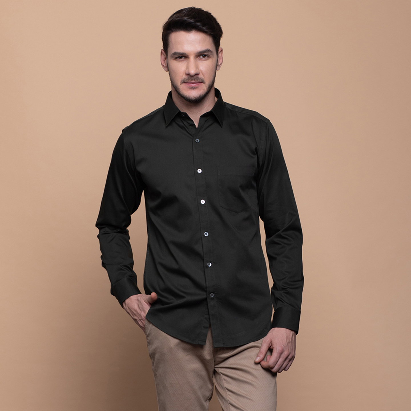 A man is wearing a spread collar shirt in Military green colour