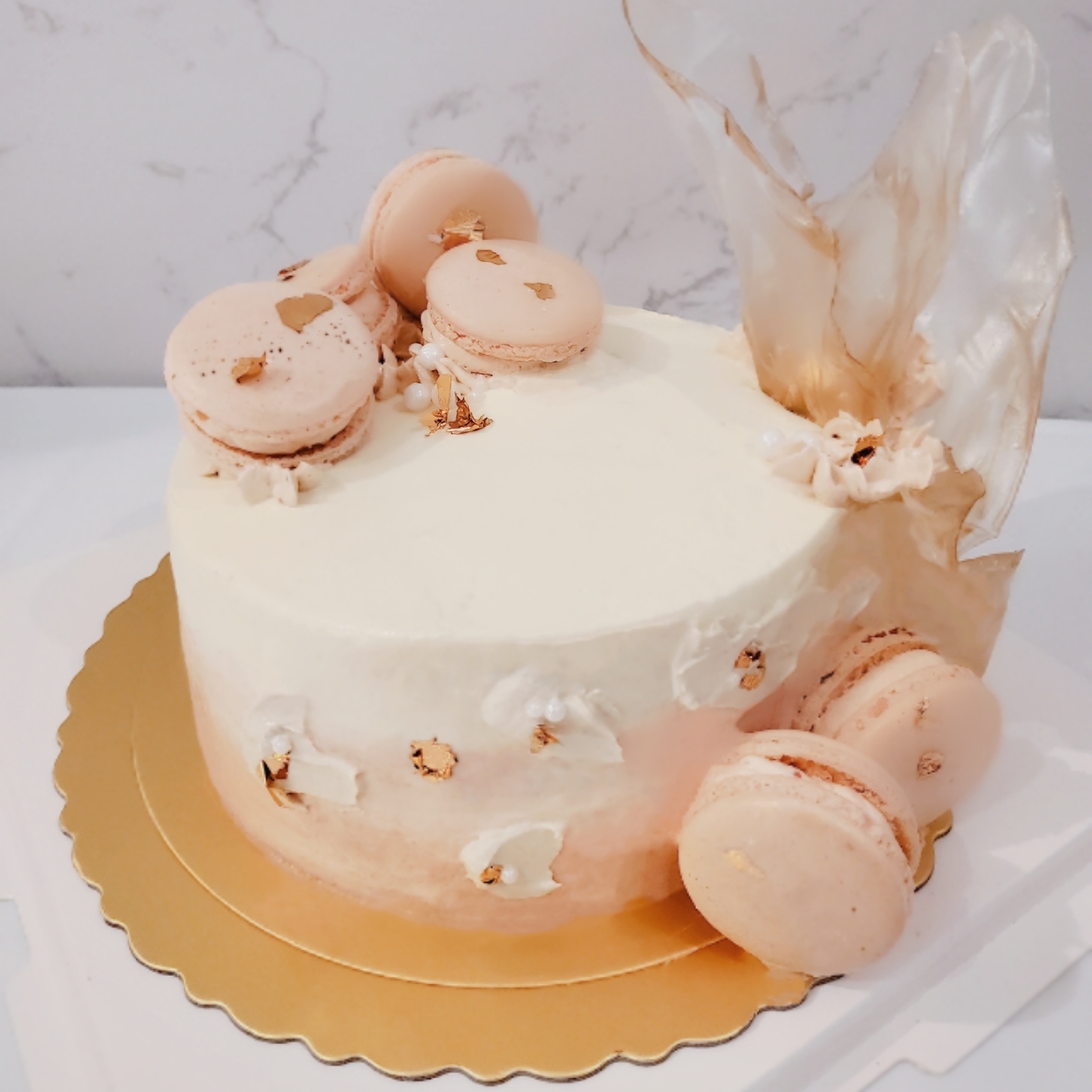 Peach Ombre Cake With Macarons & Rice Paper Sail Decorations