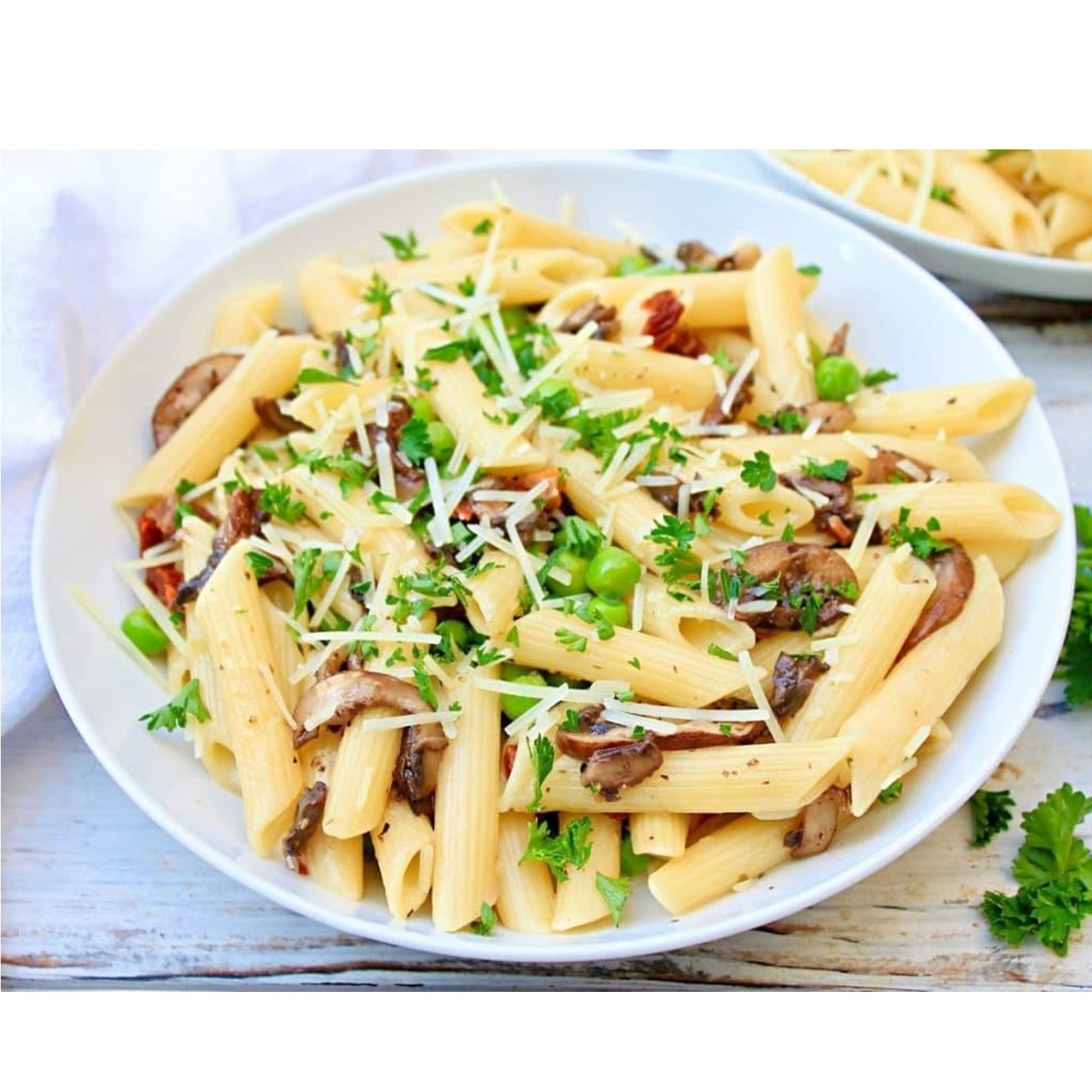 PENNE WITH MUSHROOM AND PEAS IN PARMESAN CREAM V
