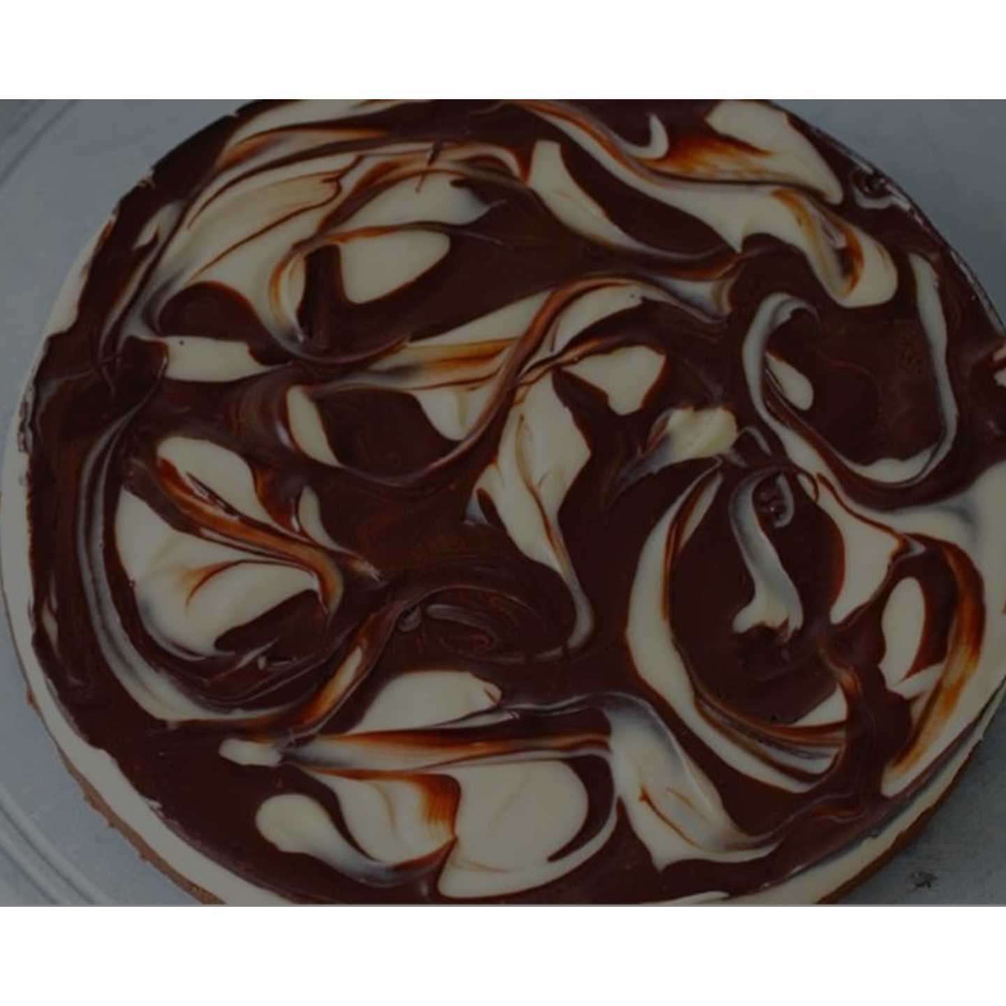 MARBLE CHEESE CAKE Chocolate biscuit crust and dark chocolate