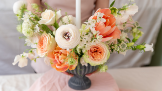 woman-holding-vase-full-of-flowers-YWBV328_70_1_70.jpg