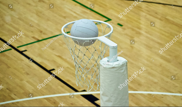 stock-photo-a-close-up-above-eye-level-view-of-a-netball-ball-entering-a-netball-goal-the-ball-sits-in-the-1442431256.jpg