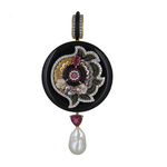 An opulent circular pendant set in pink and black combination crafted using precious gold sequins and wires embellished with gemstones and diamonds