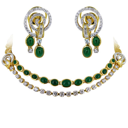 A Classic double line necklace with matching earrings in diamonds and emeralds