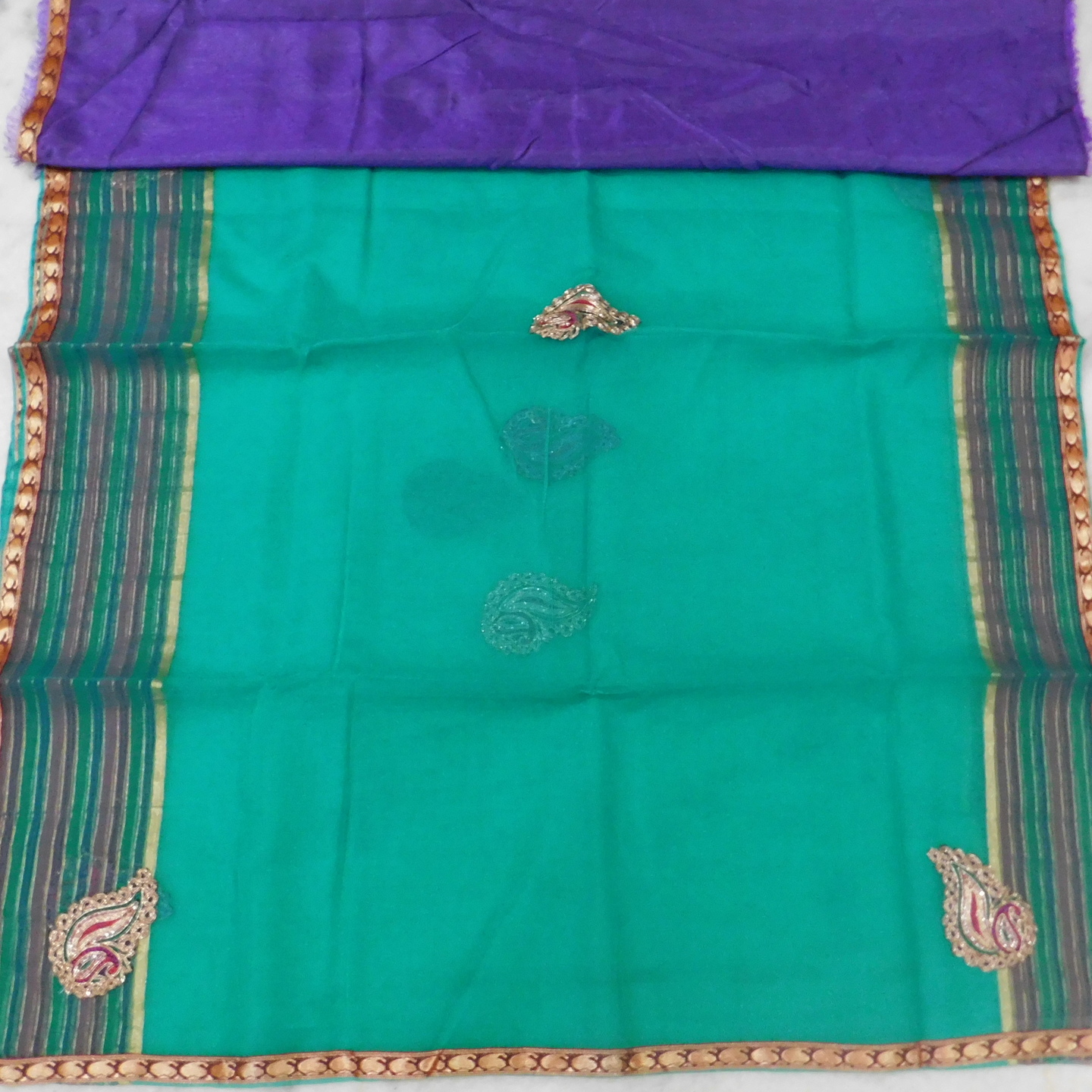 Light weight Fancy saree with Green color and purple color Blouse and border with Patch work.