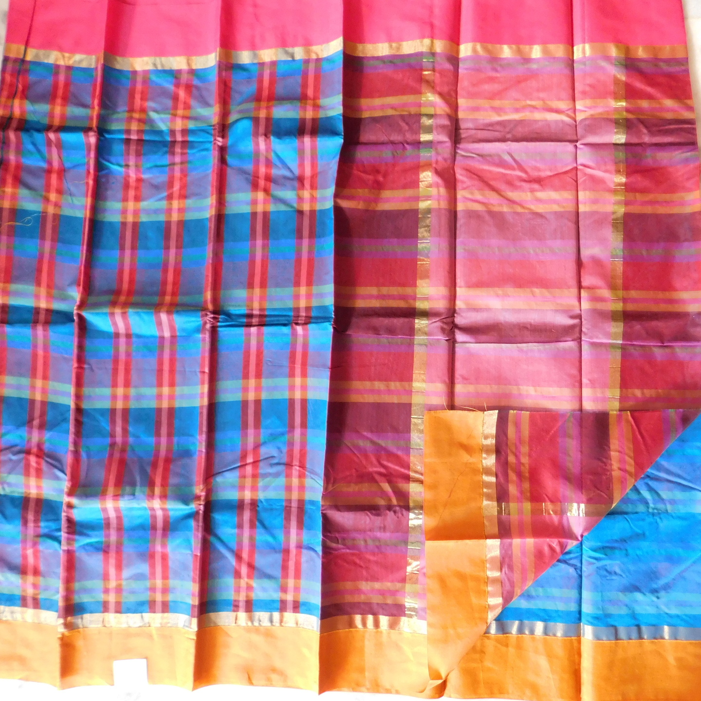 Uppada Seiko checks . Red & Blue colored checks with Ganga Jamuna Border. 