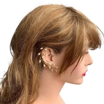 Model wearing VINI modular pearl vine earrings as ear cuffs