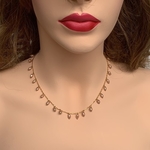 Front view of model wearing RIZZO pink rice pearl chain necklace