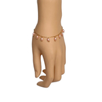 Model wearing RIZZO pink rice pearl bracelet on wrist