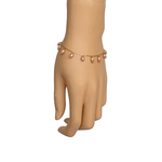 Model wearing single RIZZO peach rice pearl bracelet on wrist