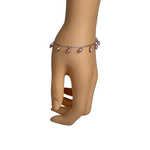 Model wearing RIZZO grey rice pearl bracelet on wrist