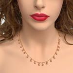 Front view of model wearing RIZZO peach rice pearl chain necklace