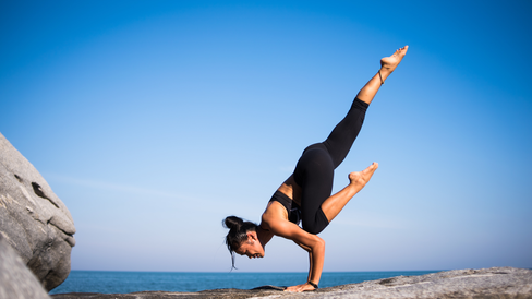 low-angle-view-of-woman-relaxing-on-beach-against-blue-sky-317157.jpg