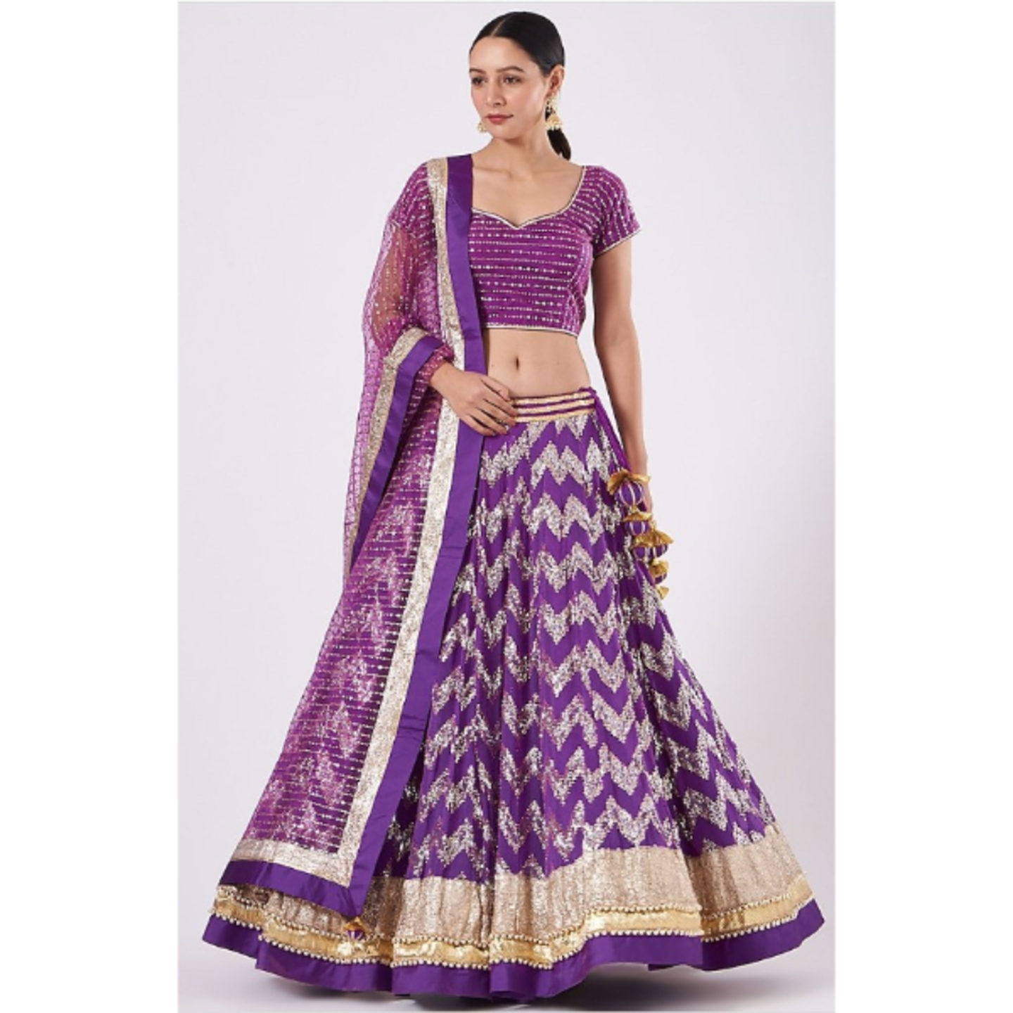 KIM MAGICAL MAUVE Georgette Lehenga set in gold and silver chevron embroidery.