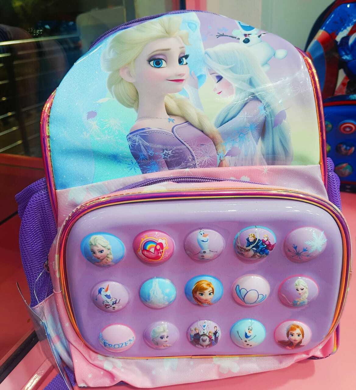 Esmi- *Hard case Premium quality School/ Picnic Bag*

Size Aprox 15inch
2 sections at back and 1 in front for lunch box , 2 side pockets 
Captain America & Frozen Theme

MRP 2299 , our price 675/-